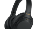 a black headphones with gold text